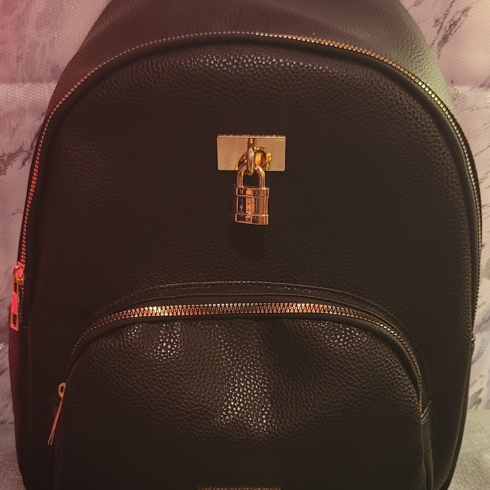 Black Pebbled Leather Backpack with Gold Accent Hardware